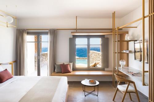 Mykonos Soul Luxury Suites客房内的一张或多张床位