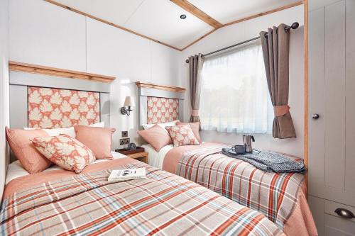 Platinum Holiday Caravan客房内的一张或多张床位