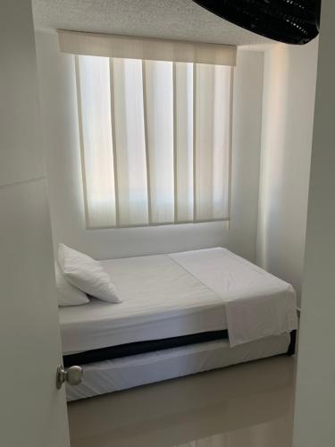 Apartamento - Tocaima客房内的一张或多张床位