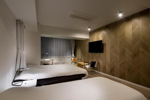 东京新宿区N.U.T.S酒店客房内的一张或多张床位
