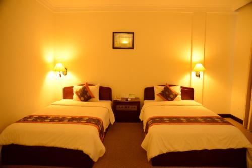 Saigon Tourane Hotel客房内的一张或多张床位