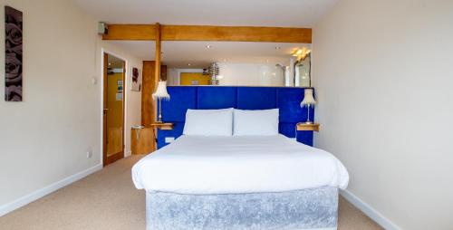 Hotel Rendezvous - Skipton - N Yorkshire客房内的一张或多张床位