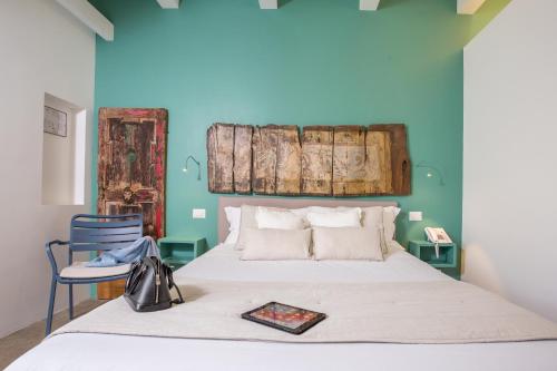 茵托诺阿尔费科酒店客房内的一张或多张床位