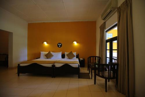 Kithulgala Rest House客房内的一张或多张床位