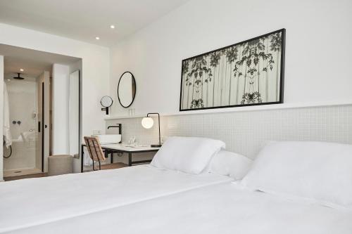 杜纳斯布兰卡斯HM酒店客房内的一张或多张床位