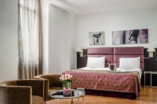 欧洲之星罗马亚特尔纳酒店客房内的一张或多张床位