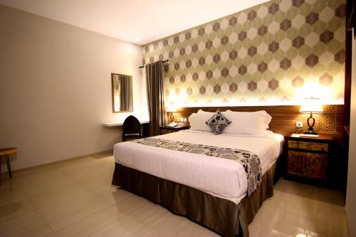 格兰德阿米拉酒店客房内的一张或多张床位