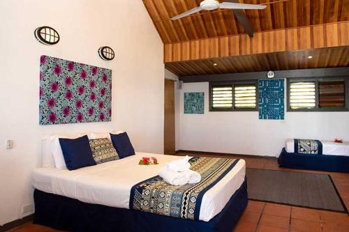 Belo Vula Island Resort Limited客房内的一张或多张床位