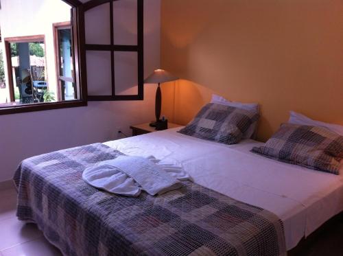 多斯维达挂啦帕里旅馆客房内的一张或多张床位