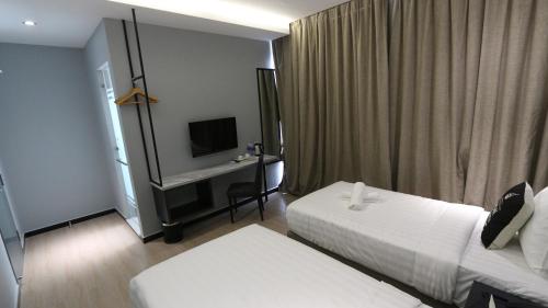 Hotel 99 Sepang KLIA & KLIA2客房内的一张或多张床位