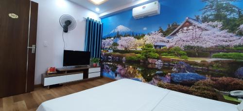 海防SƠN HÀ Motel的卧室配有花园壁画