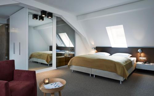 魏因豪斯亨宁格酒店客房内的一张或多张床位