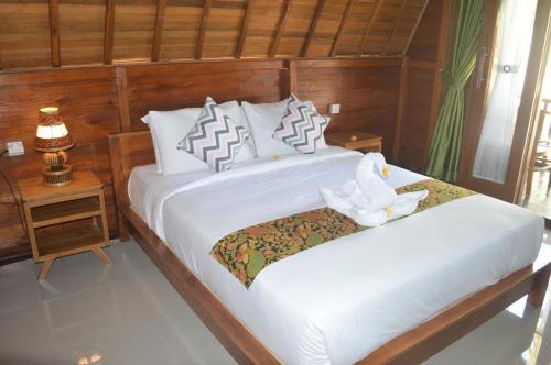 Nyuh Gading Bungalow Nusa Penida客房内的一张或多张床位