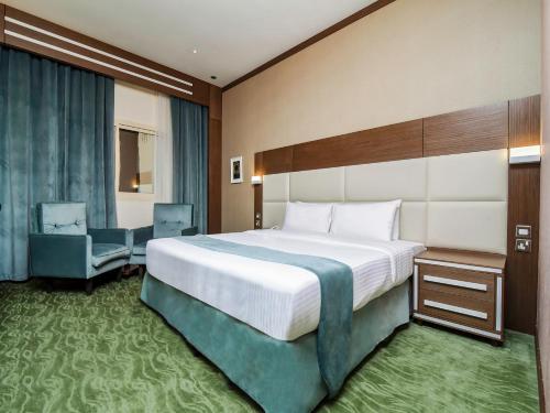 Ras Al Khaimah Hotel客房内的一张或多张床位