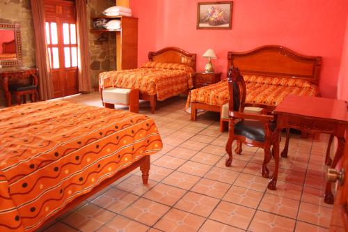 波萨达香格里拉卡瑟纳科尔特斯精品酒店客房内的一张或多张床位