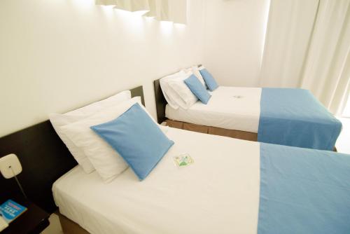 Hotel Maranata Valledupar客房内的一张或多张床位