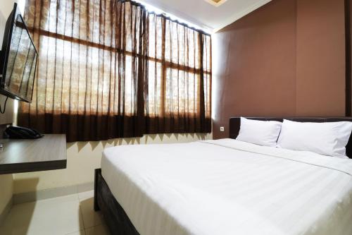 Hotel Istana Bungur客房内的一张或多张床位