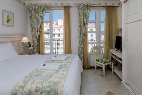 IL Campanario Villaggio Resort - OFICIAL客房内的一张或多张床位