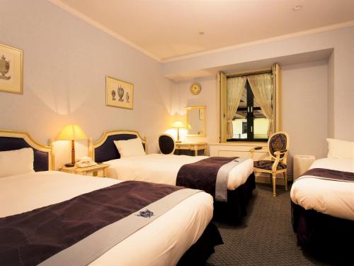 大阪蒙特利酒店客房内的一张或多张床位