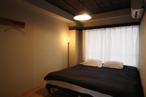 Beppu hostel&cafe ourschestra客房内的一张或多张床位