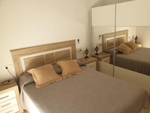 Ático Residencial Alejandria客房内的一张或多张床位