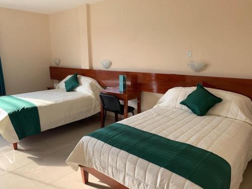 Tariri Hotel客房内的一张或多张床位
