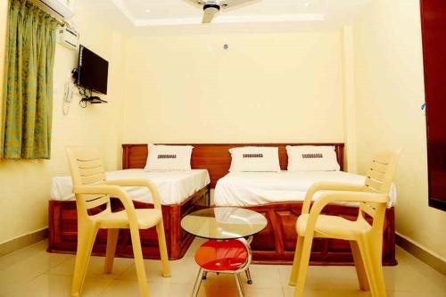 Shubhanga Residency客房内的一张或多张床位