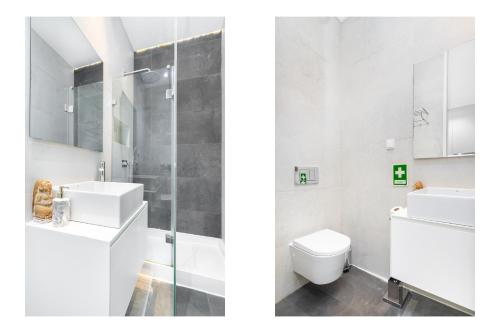 里斯本WHome | Downtown Family Apartment的白色的浴室设有卫生间和水槽。