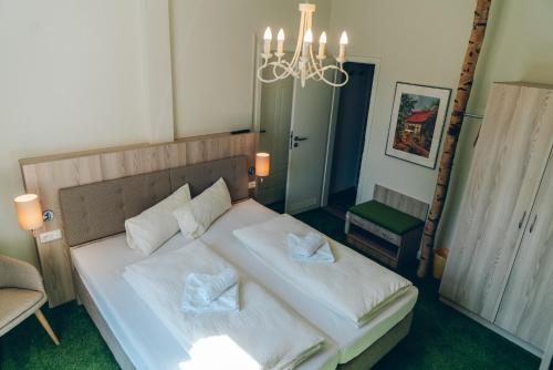 阿德尔海德加尼酒店客房内的一张或多张床位