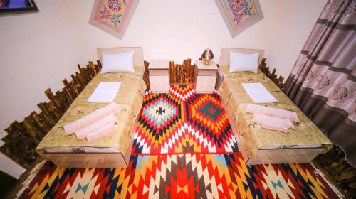 Khiva Muhammadali客房内的一张或多张床位