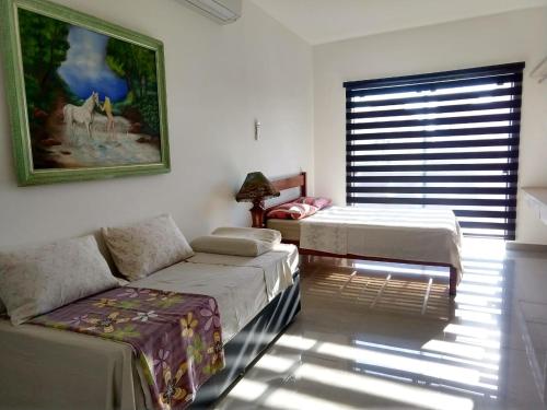 Casa da Lúcia客房内的一张或多张床位