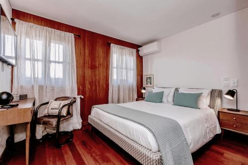 Charming Bonfim Penthouse客房内的一张或多张床位
