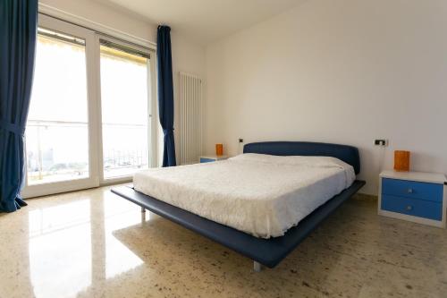 Le Murrine Frontemare Apartment Seaview客房内的一张或多张床位