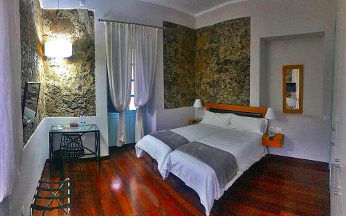 Hotel Rural Triana客房内的一张或多张床位