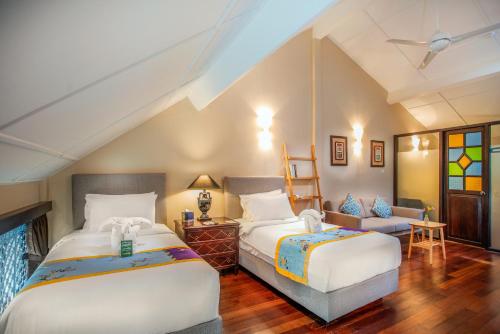 槟城槟榔酒店客房内的一张或多张床位