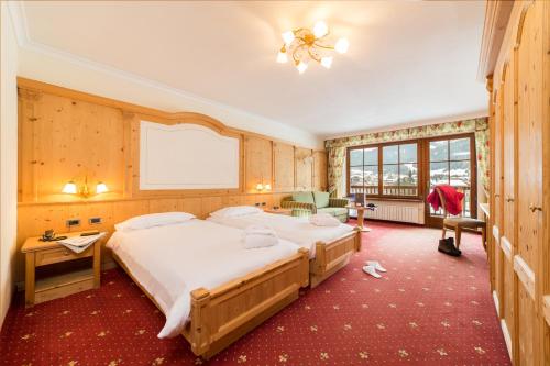 TH Corvara - Greif Hotel客房内的一张或多张床位