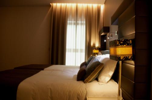 利雅精品水族酒店客房内的一张或多张床位