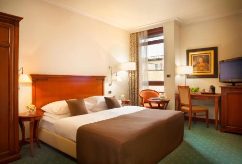 贝斯特韦斯阿斯托里亚高级酒店客房内的一张或多张床位