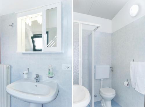 阿莱萨诺Affittacamere Room and Breakfast Antonuccio的一间带水槽、卫生间和镜子的浴室