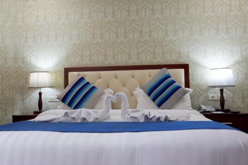 Tolip Olympia Hotel客房内的一张或多张床位