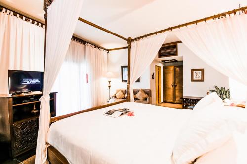 Hotel Tugu Malang - CHSE Certified客房内的一张或多张床位