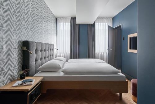 Hotel MIO by AMANO客房内的一张或多张床位