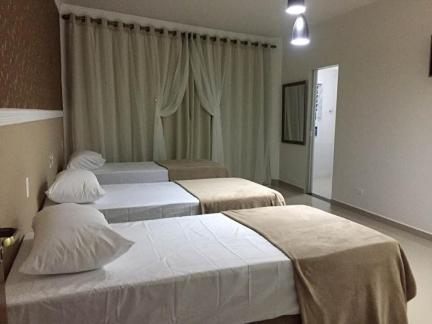 Hotel Guarulhos客房内的一张或多张床位