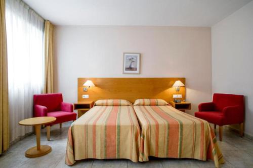 罗斯提茨酒店客房内的一张或多张床位