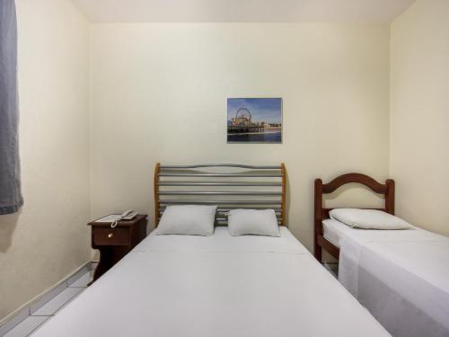 Netuno Beach Hotel客房内的一张或多张床位