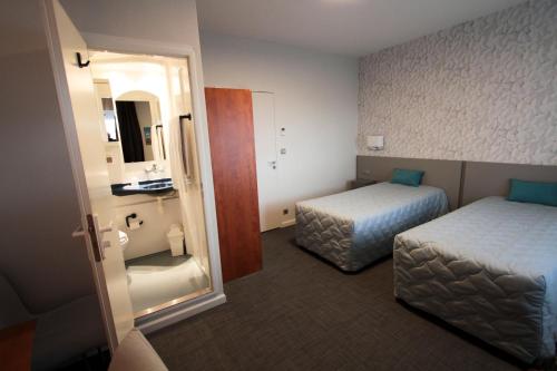 让博斯科中心酒店客房内的一张或多张床位