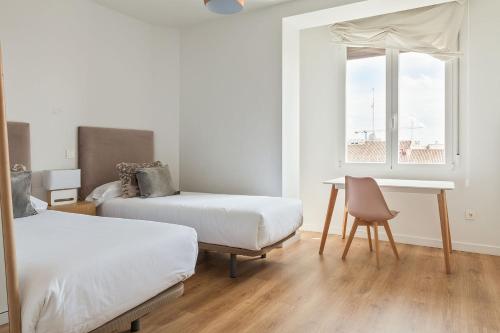 Canaan Boutique Apartments Madrid客房内的一张或多张床位