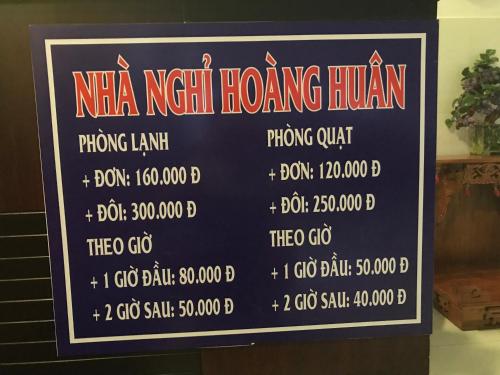 龙川市Nhà nghỉ Hoàng Huân的一家nza新开的酒馆的标志