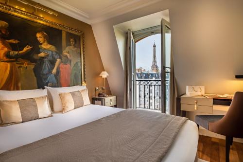 巴黎Hôtel Le Walt by Inwood Hotels的卧室的墙上挂着一幅大画