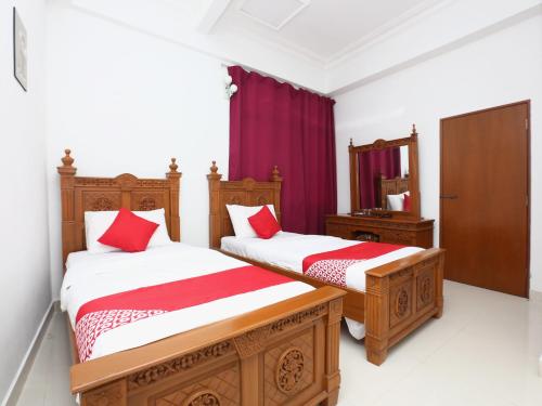 Super OYO 89435 Nusantara Group Hotel客房内的一张或多张床位